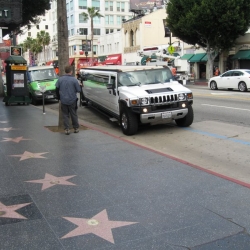 The Hummer limousine rolls up, cameras waiting...