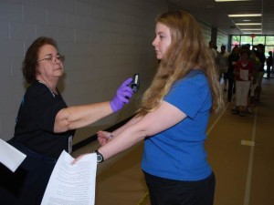 Medical Reserve Corps checks individual for radiation